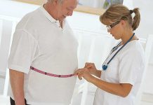 Pharma Giant’s Breakthrough: Weight Loss Like Never Before A healthcare professional measuring a patients waist with a tape measure