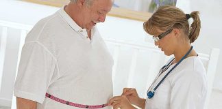 Pharma Giant’s Breakthrough: Weight Loss Like Never Before A healthcare professional measuring a patients waist with a tape measure