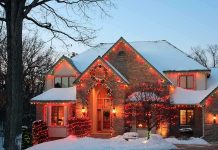 Homeowner THREATENS Christmas Carolers With GUN A beautifully decorated house with Christmas lights in a snowy setting