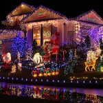 Nativity Scene Showdown: Mayor vs. Town A house decorated with colorful Christmas lights and festive figures