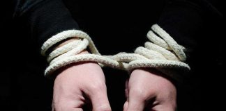 Cartel Thugs Snatch Top Engineers Hands tied with rope in the dark.