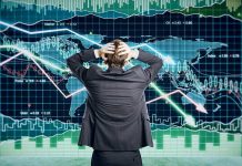 Canada Faces Economic Turmoil—What’s Next? Person in front of falling stock market graph.