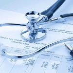 Pandemic Subsidies Gone – Healthcare Costs EXPLODE A stethoscope resting on a medical billing statement