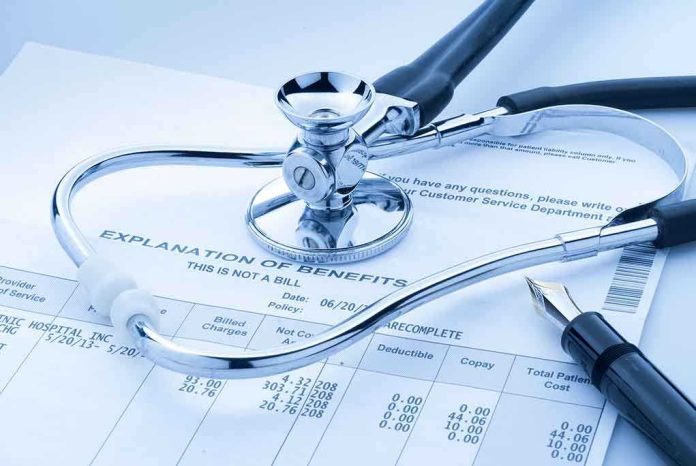 shutterstock_144311362.jpg A stethoscope resting on a medical billing statement