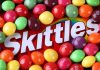 Kennedy’s Bold SNAP Reform: Candy Out! A colorful assortment of Skittles candies surrounding the Skittles packaging