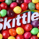 Kennedy’s Bold SNAP Reform: Candy Out! A colorful assortment of Skittles candies surrounding the Skittles packaging