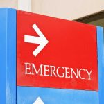 HORRIFIC Hospital Intake Sparks Murder Charge Emergency sign with an arrow pointing right