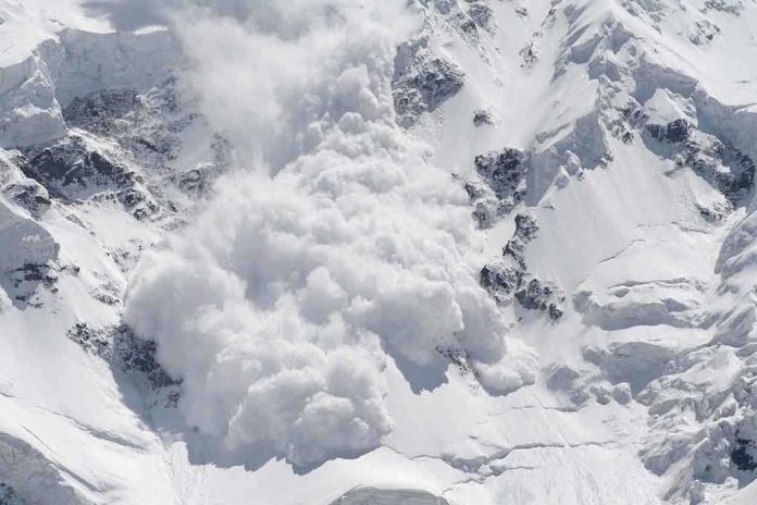shutterstock_17964235.jpg An avalanche occurring on a snowy mountain slope