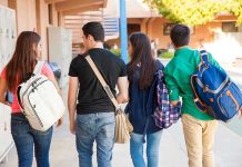 Group of students walking together in a school corridor