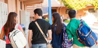 Group of students walking together in a school corridor