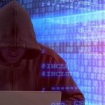Person in hoodie using laptop, surrounded by digital code.