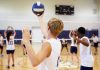 Senator SLAMS Female Athlete—Nation Furious Players about to serve a volleyball in gym.