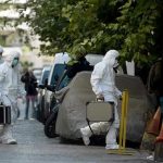 SWAT Surrounds Mansion — Millionaire Found DECOMPOSING Investigators in hazmat suits carrying equipment cases.