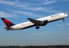 Delta Strips Congress VIP Escorts Delta airplane taking off from runway.
