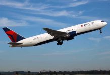 Delta Strips Congress VIP Escorts Delta airplane taking off from runway.