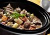 A hearty beef stew with vegetables in a slow cooker