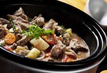 A hearty beef stew with vegetables in a slow cooker