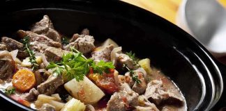 A hearty beef stew with vegetables in a slow cooker