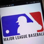 Major League Baseball logo on a smartphone screen.
