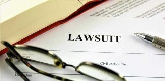 Trump’s $10 Billion Lawsuit REJECTED Lawsuit document with glasses, pen, and book.