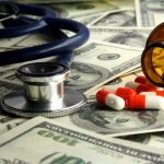 FELONY Charges For Mail-Order Abortion Pills Stethoscope and prescription pills on a background of dollar bills