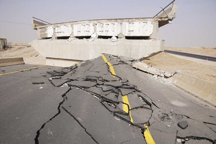 Severely damaged road and collapsed bridge due to earthquake
