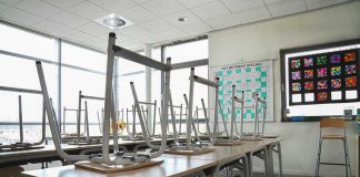 Principal’s BRAVE Move Stops School Massacre Empty classroom with chairs on top of desks.
