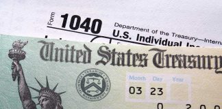 Tax Day STUNT Sparks NYC Tax War Close-up of a U.S. Treasury check and tax form 1040