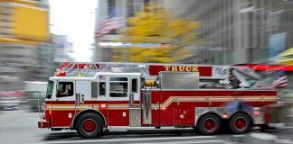Woman KILLED – Firetruck Crushes Her On Way To Emergency! Red fire truck driving through city street crosswalk