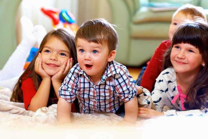 A group of children enjoying playtime indoors, displaying joyful expressions