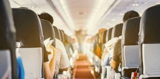 Airplane Window Rips – Passenger CLINGS to Chair Passengers seated inside an airplane cabin.
