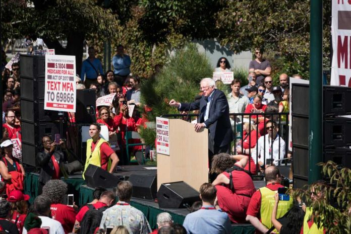 bernie-sanders1031332558jpg speaker at outdoor rally addressing a large crowd