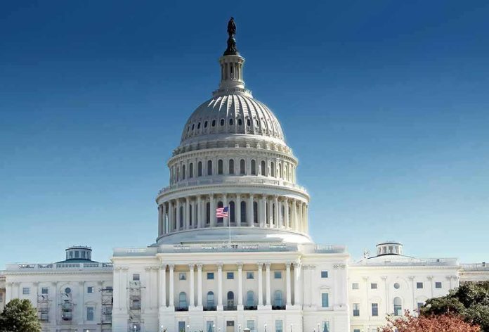 shutterstock_1034821033 United States Capitol building with dome under clear blue sky