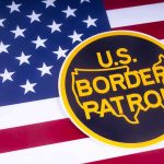 U.S. Border Patrol emblem on American flag