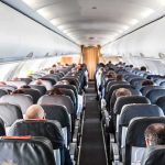 Preacher BOOTED OFF Flight When This Happened Airplane cabin with passengers seated in rows