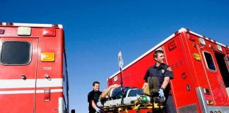 Medics Horrific Blunder Murders Patient Paramedics move a patient on a stretcher between red ambulances