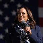 Kamala Commits Embarrassing Blunder as She Launches Radical 2028 Plan Woman speaking into a microphone on a stage