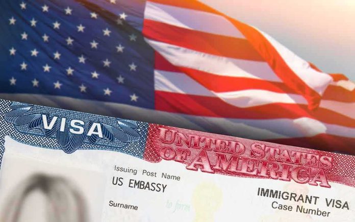 shutterstock_1983291833 US visa document with American flag in background