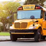 Yellow school bus with stop sign extended