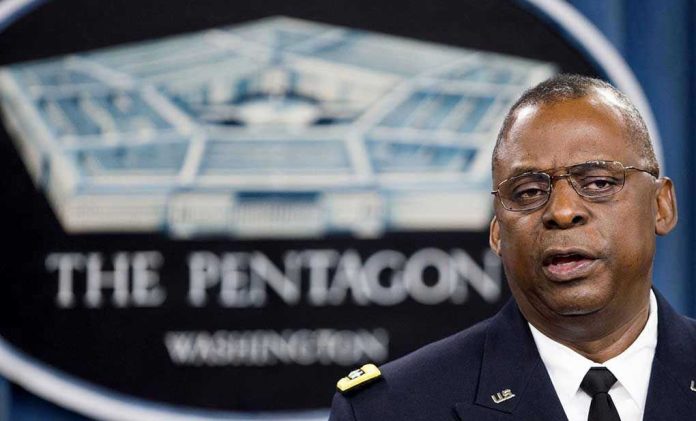 2027618987 Lloyd Austin speaking at a podium in front of a Pentagon emblem