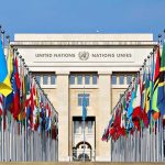 Muslim Mayor Sets Up Meeting With Iran Leaders United Nations building with numerous national flags outside.