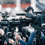 SCOTUS Shocks D.C.: Votes 9-0! Broadcast cameras on tripods at a press event