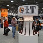 Henry booth with rifles on display at a trade show