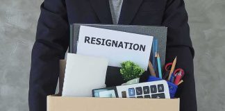 Governor Demands Her Own Lt Gov RESIGNS! Person holding a cardboard box of office belongings