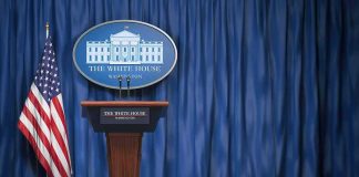 Trump TV Goes Live – Immediately Gets Blasted White House press briefing podium with U.S. flag and blue curtain