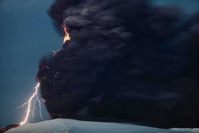 Volcanic eruption with dark ash plume and lightning