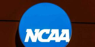 NCAA Football Star Killed in Nightclub Brawl NCAA logo on a blue circular sign