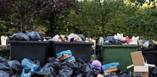 Mom Pleads GUILTY – Murdered Child in Dumpster Overflowing dumpsters with piles of trash bags and cardboard