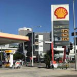 Shell gas station with price sign on a sunny day