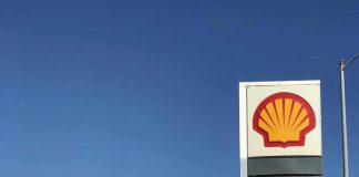 Shell gas station with price sign on a sunny day